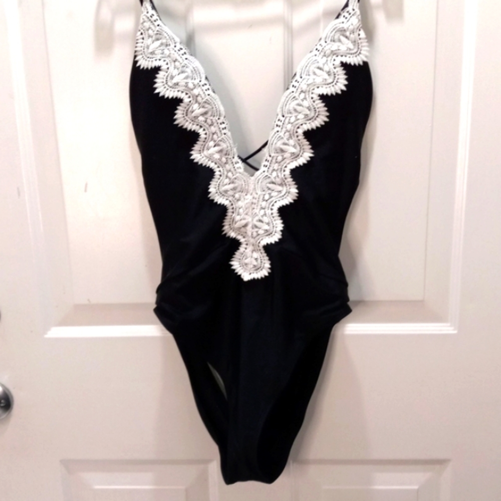 Colloyes Black W/White Lacy Deep Sexy Front ,no back One Piece Size Large.
